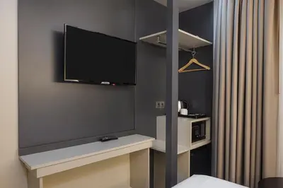 a room with a tv on the wall at Garner Hotel Istanbul - Airport Arnavutkoy by IHG in Istanbul