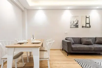 a living room with a table and a couch at Chido Residence in Istanbul