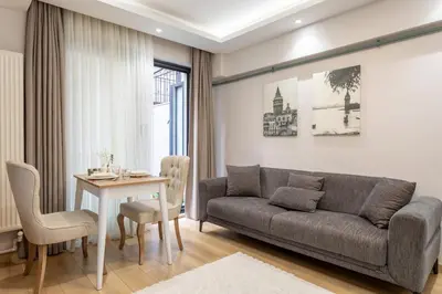 a living room with a couch and a table at Chido Residence in Istanbul