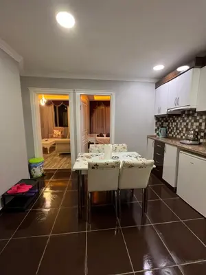 a kitchen with a table and chairs in a room at TAKSİM CMLM Suit in Istanbul