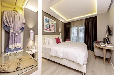 two pictures of a hotel room with a bed at Barbera Hotel in Istanbul