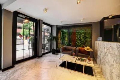 a living room with a couch and a table at The Capital Suites in Istanbul