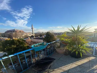 a balcony with plants and a blue fence at Sultanahmet Apart Hotel in Istanbul