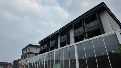 a building with large windows on the side of it at farazarooms in Serdivan
