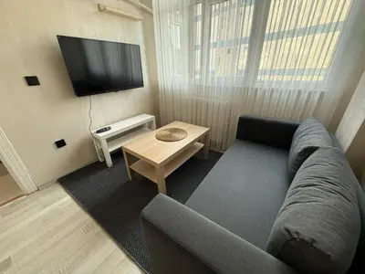 a living room with a couch and a tv at Serene in Istanbul