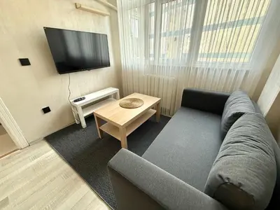 a living room with a couch and a tv at Serene in Istanbul