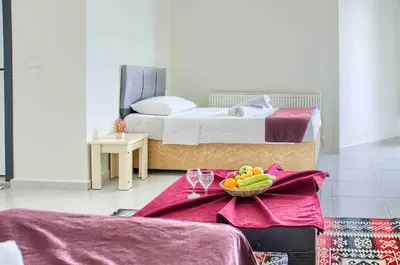 a bedroom with a bed with a bowl of fruit on a table at Hotel yeniçiftlik in Yeniçiftlik