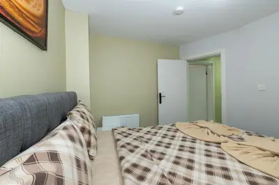 a bed with a blanket on it in a bedroom at rest at home in Istanbul