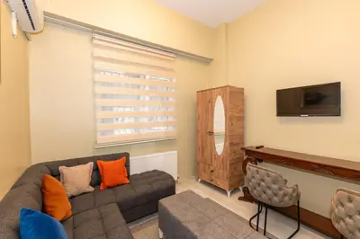 a living room with a couch and a tv at rest at home in Istanbul