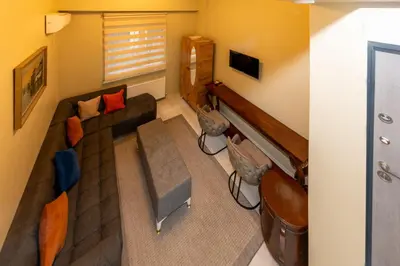 a living room with a couch and a piano at rest at home in Istanbul