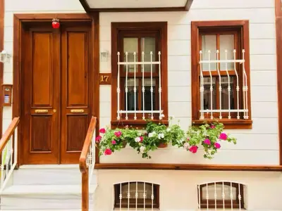 a house with flowers in a window box at Authentic Turkish Home Standard Room in Istanbul