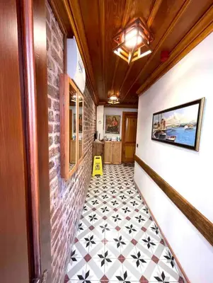 a hallway with a tiled floor in a house at Authentic Turkish Home Standard Room in Istanbul