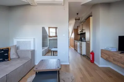 a living room with a couch and a table at Raya Cihangir Suites in Istanbul