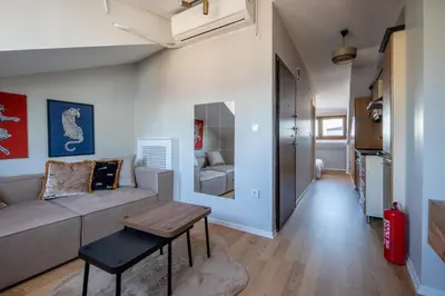 a living room with a couch and a table at Raya Cihangir Suites in Istanbul