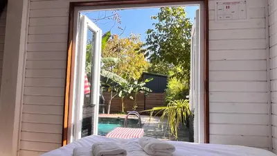 an open door to a patio with a view of a pool at Loft Black Sapanca in Sapanca