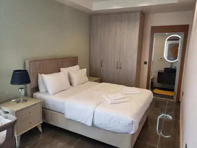 a bedroom with a bed with two towels on it at Comfort 4 bedroom villa yalova see view in Termal