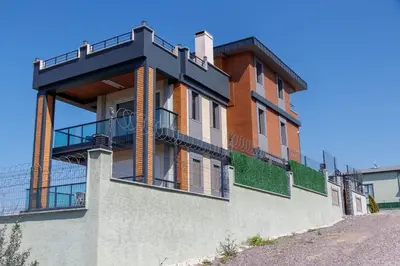 a building with a balcony on the side of it at Comfort 4 bedroom villa yalova see view in Termal
