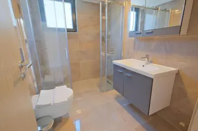 a bathroom with a toilet and a sink and a shower at Mayer Skycon Residence in Beşiktaş 2 in Istanbul