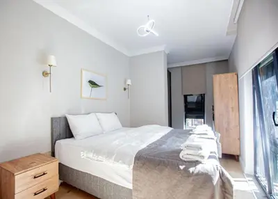 a bedroom with a large bed and a window at Mayer Skycon Residence in Beşiktaş 2 in Istanbul