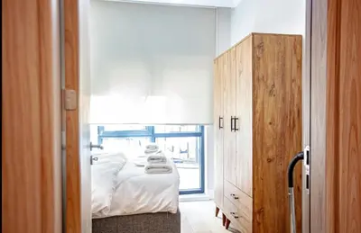 a small bedroom with a bed and a window at Mayer Skycon Residence in Beşiktaş 2 in Istanbul