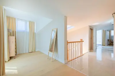 a room with white walls and a staircase and a mirror at Mayer Skycon Residence in Beşiktaş 2 in Istanbul