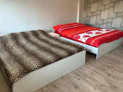 two beds sitting next to each other in a room at City Center Suite in Istanbul