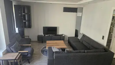 a living room with a couch and a table at City Center Suite in Istanbul