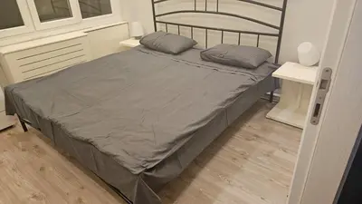 a bed with two pillows on it in a bedroom at City Center Suite in Istanbul