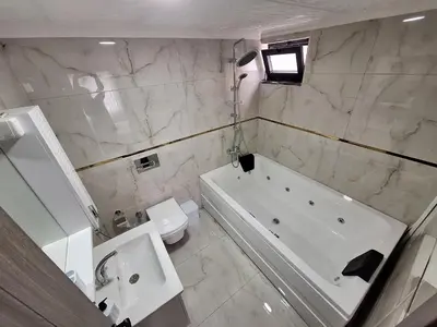 a white bathroom with a tub and a toilet at Daly Resort 1 in Sapanca