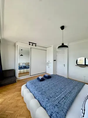 a bedroom with a large bed and a large mirror at Deluxe Duplex in city center with 210 degrees Bosphorus viewed in Istanbul