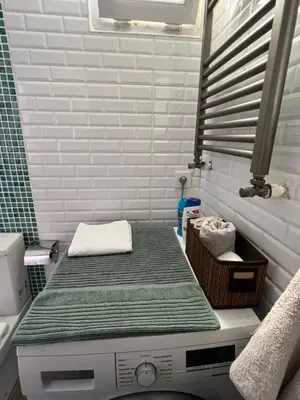 a mattress sitting on top of a washing machine in a bathroom at Deluxe Duplex in city center with 210 degrees Bosphorus viewed in Istanbul