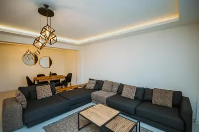 a living room with a couch and a table at One Suit in Kartepe