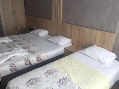 two beds sitting next to each other in a room at City Light Otel in Istanbul