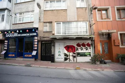 a store on the side of a street with a red umbrella at SULTANAHMET oldcity nice suite in Istanbul