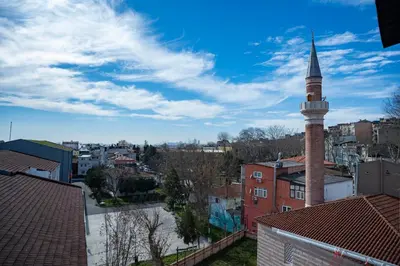 a mosque with a tall tower in a city at SULTANAHMET oldcity nice suite in Istanbul