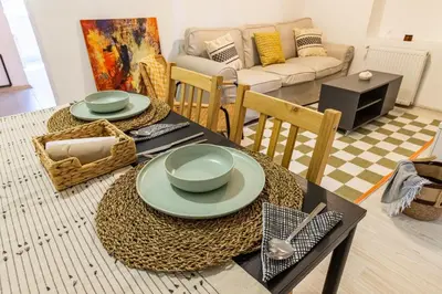 a living room with a table with plates on it at Maison Istanbulite in Istanbul