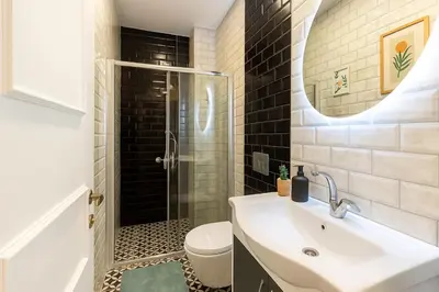 a bathroom with a sink and a shower at Maison Istanbulite in Istanbul