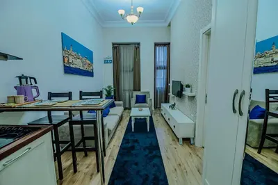 a living room with a couch and a table at Istiklal Nil Suites in Istanbul