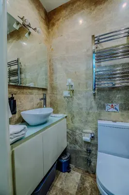 a bathroom with a sink and a toilet at Istiklal Nil Suites in Istanbul
