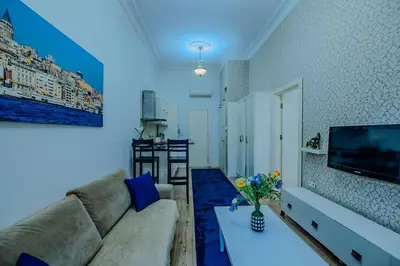 a living room with a couch and a table at Istiklal Nil Suites in Istanbul