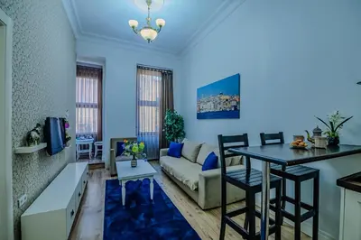 a living room with a couch and a table at Istiklal Nil Suites in Istanbul