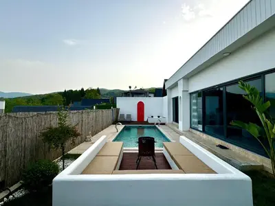 a swimming pool in the backyard of a house at Sakarya Sapanca Memnuniye de 2 oda 1 salon Özel Havuzlu , Muhafazakar , Şömineli , Jakuzili 6 Kişilik Tatil Villası in Sapanca