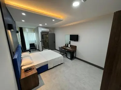 a hotel room with a bed and a desk at Trio Palace in Istanbul