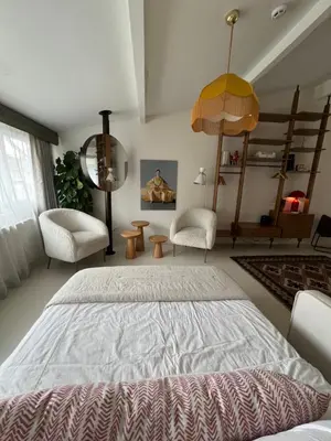 a bedroom with a large bed and two chairs at Lobby No23 in Istanbul