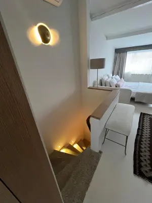 a room with a bed and a desk and a mirror at Lobby No23 in Istanbul