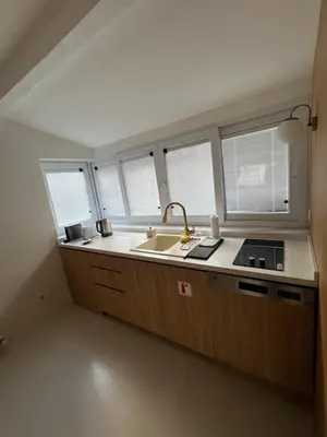 a kitchen with a sink and four windows in it at Lobby No23 in Istanbul