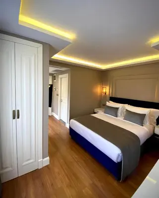 a large bedroom with a large bed in it at Ozkaya Apartments Galata in Istanbul