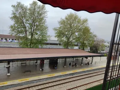 a train station with people sitting on the platform at The Bail Hotel in Istanbul