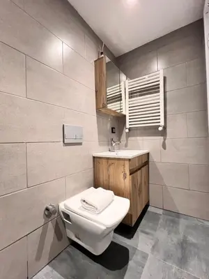 a bathroom with a toilet and a sink at The Bail Hotel in Istanbul