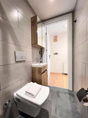 a bathroom with a white toilet and a sink at The Bail Hotel in Istanbul
